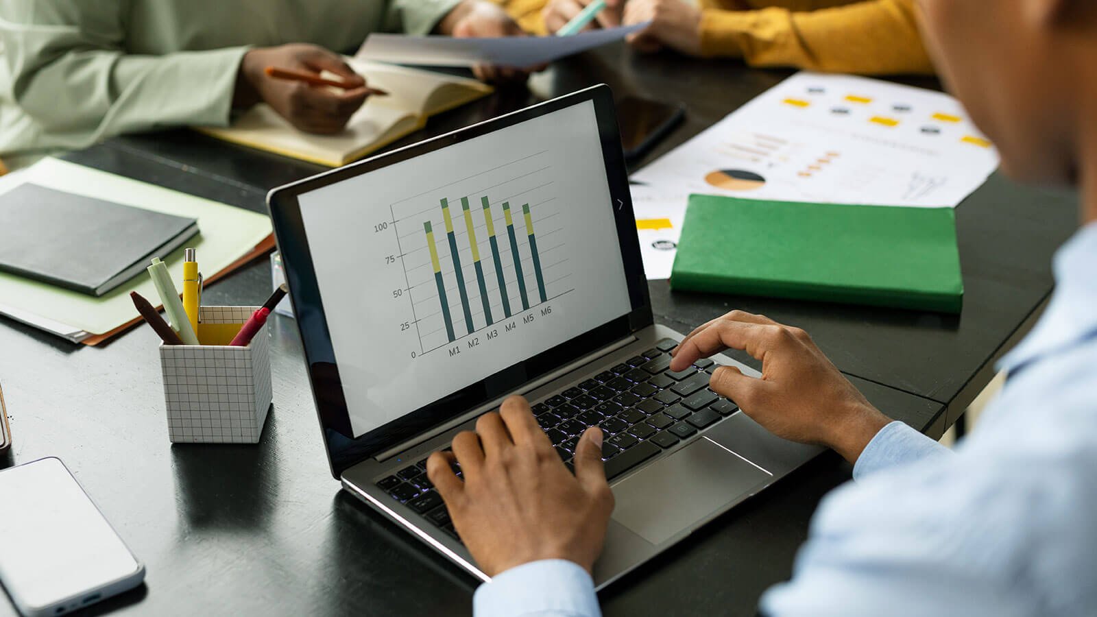 Business professionals engaged in a strategic discussion around a conference table