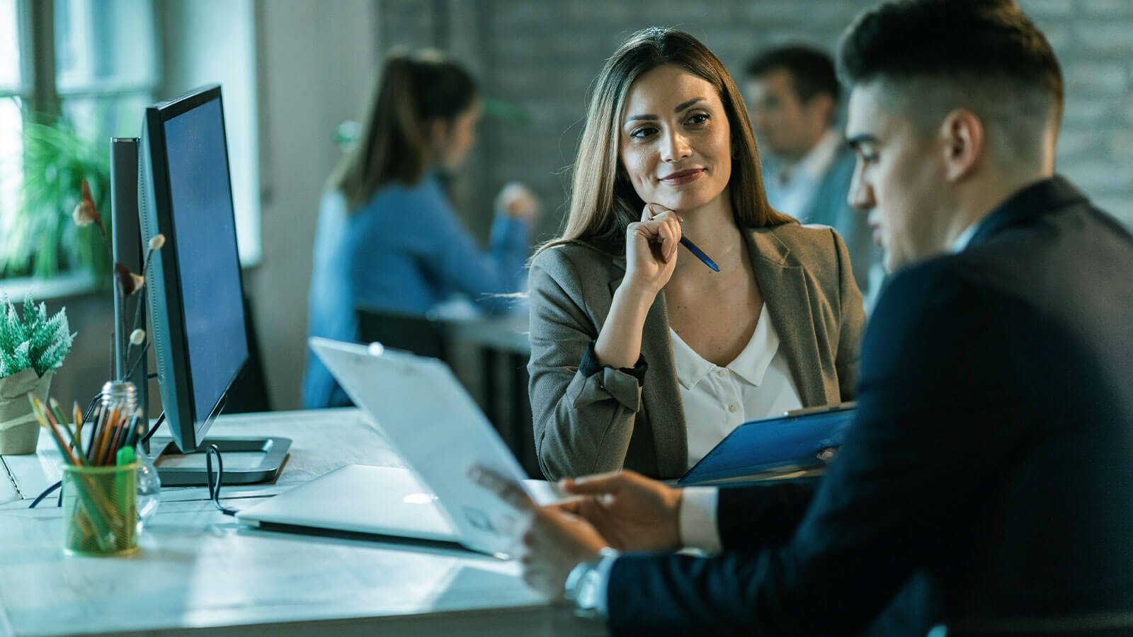 Professional team collaborating in a modern business environment
